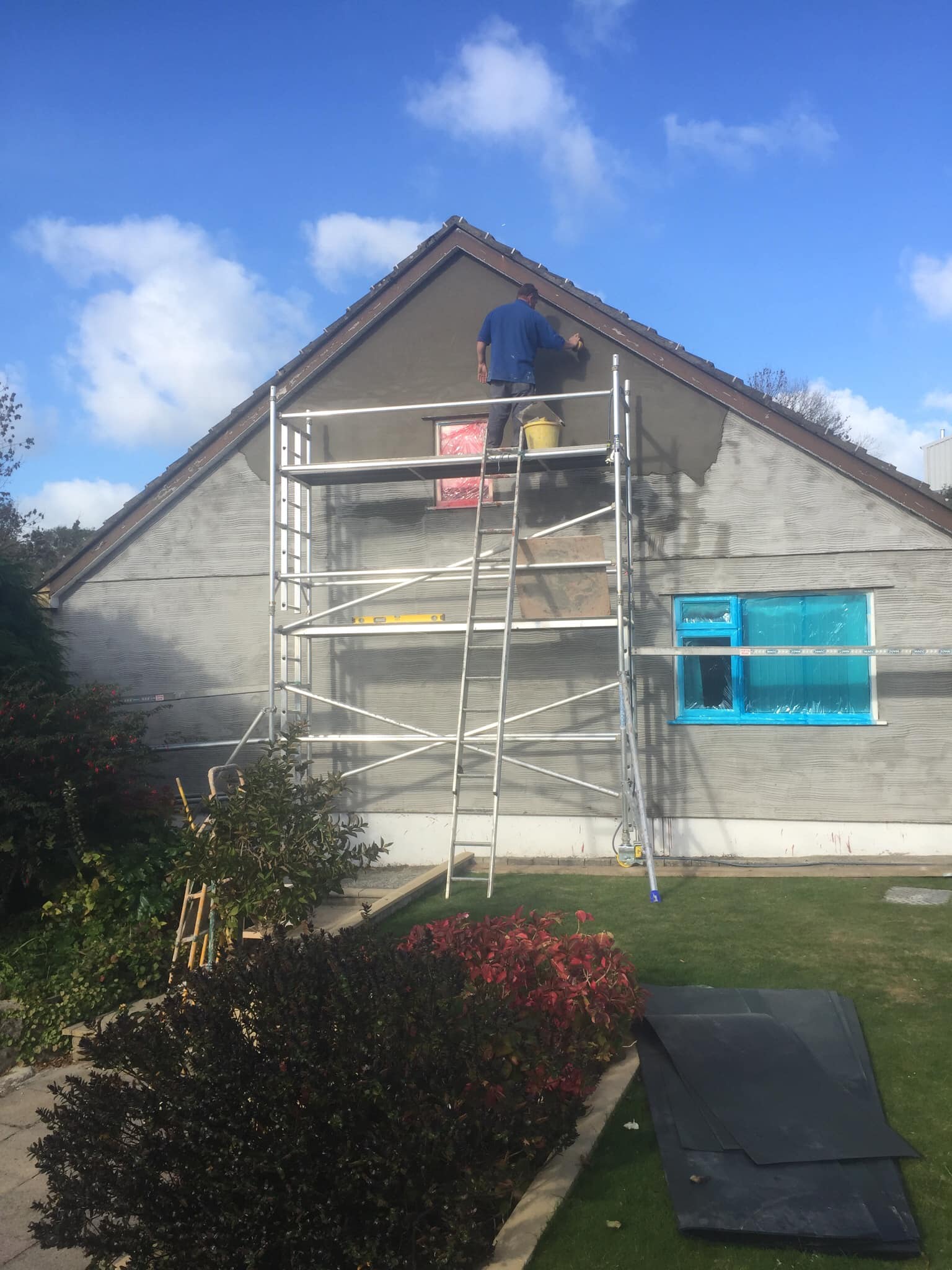 Expert plasterers working on a project in Anglesey